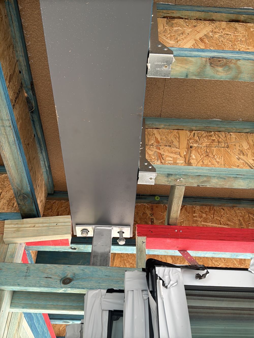 Bolt at a steel beam connection left loose and needing proper tensioning, Gables