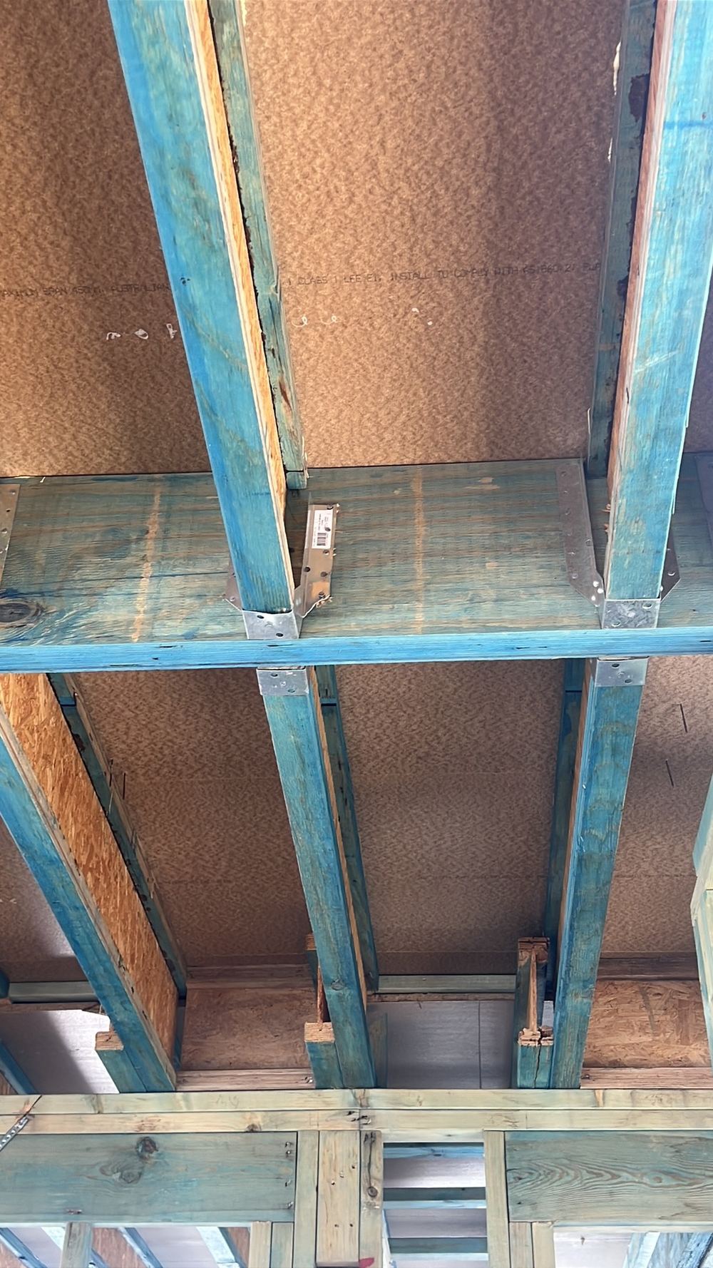 Joist hanger too small for the timber member it is meant to carry, found during a frame inspection in Gables
