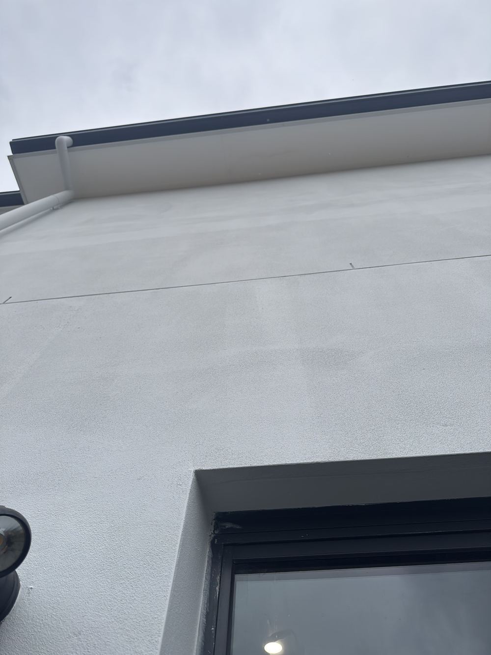 Expansion joint shown on the plans but missing from the finished wall, found during a handover inspection in Gables