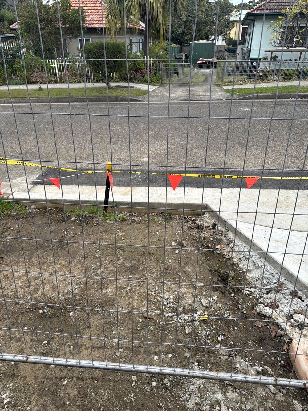 No kerb stormwater outlet where the driveway meets the road, recorded during a defect investigation in Ermington
